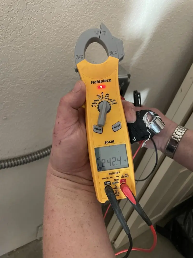 Voltage testing with clamp meter during Generator Installation in Riverside